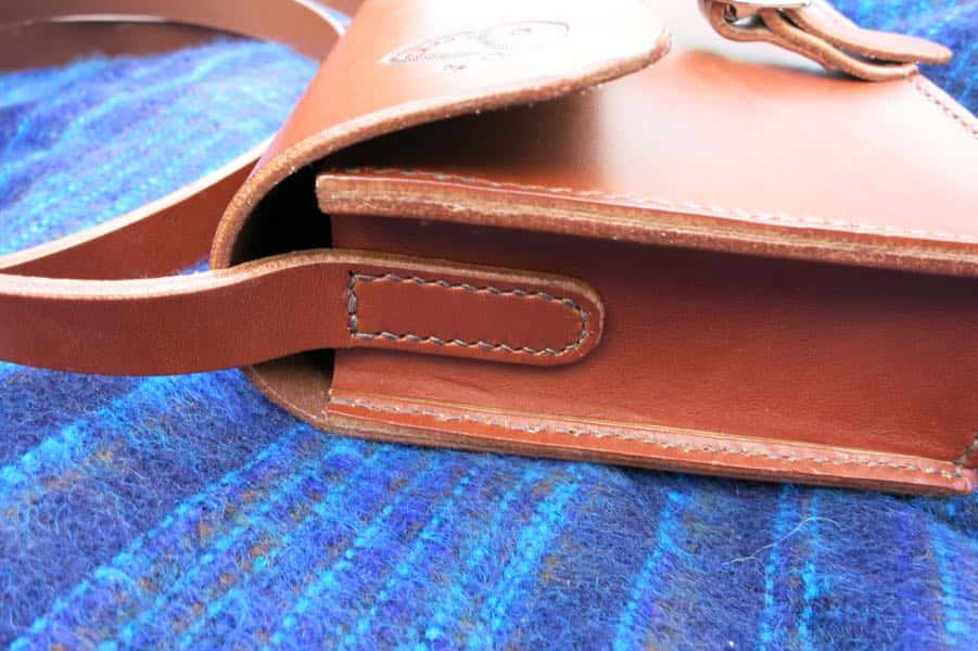 Small brown leather shoulder bag strap detail