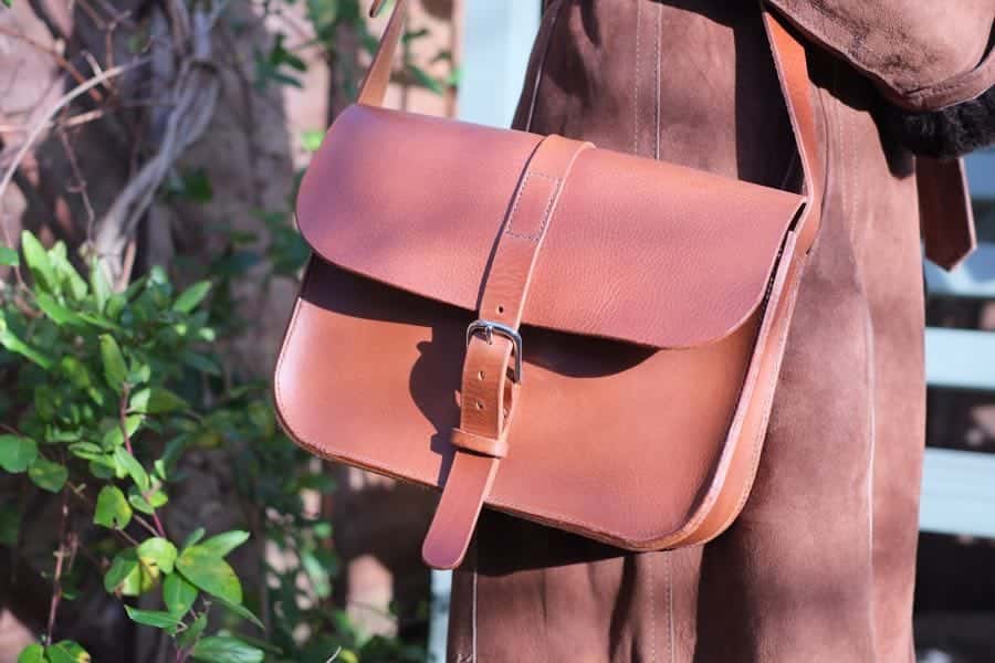 Large leather shoulder bag worn