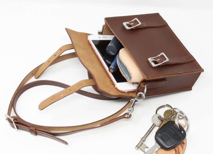 Mini satchel leather handbag show contents