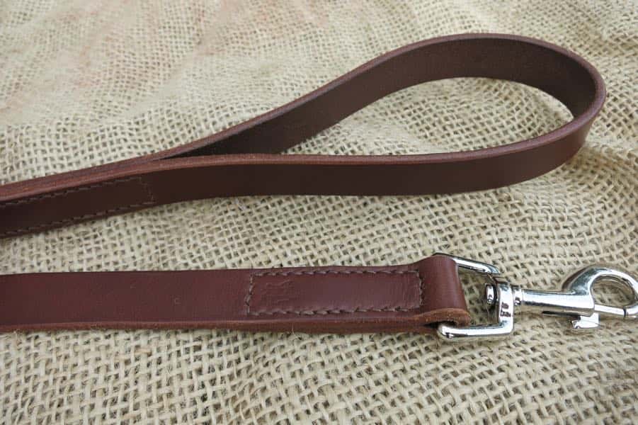 Detail of clip and loop handle on plan leather dog lead