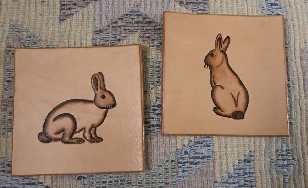 Square leather drinks coasters with rabbit motif