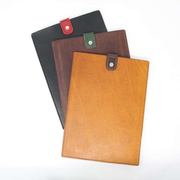 Three leather tablet sleeves; tan, black and brown with pop fasteners
