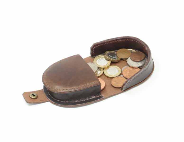 Brown leather coin catcher purse with press stud open, shown with coins
