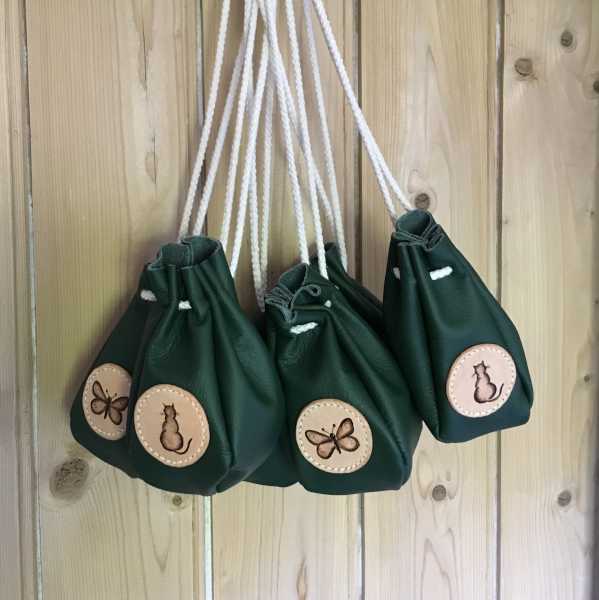 Green leather drawstring pouches with cat and butterfly motifs