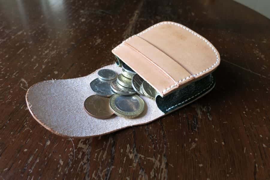 Leather large leather pouch being used as a coin purse