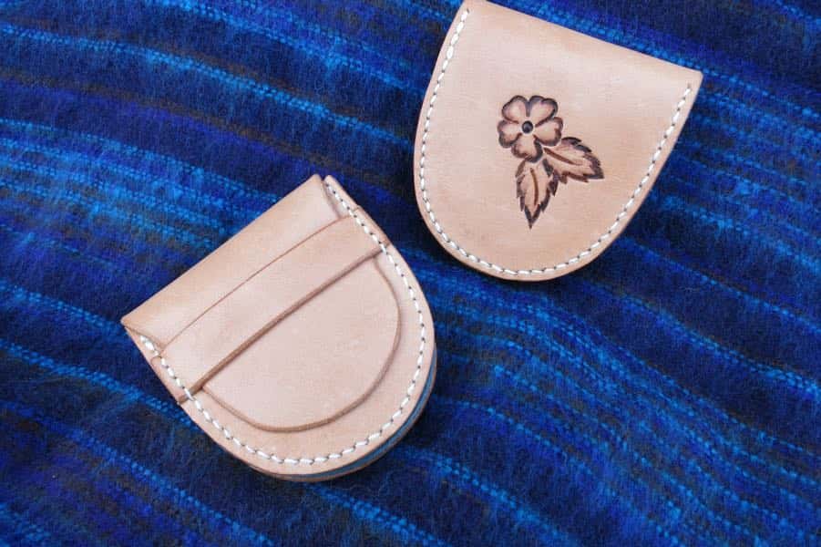 Small natural leather coin pouch showing rose motif