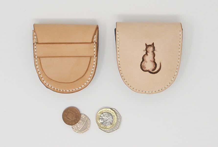 Natural leather coin pouch showing front and rear with cat motif
