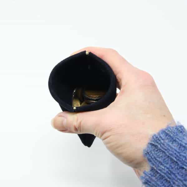 Traditional navy blue suede snap purse shown open