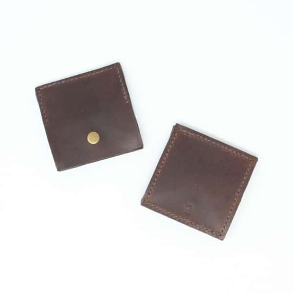 Back and front of square brown leather coin purse